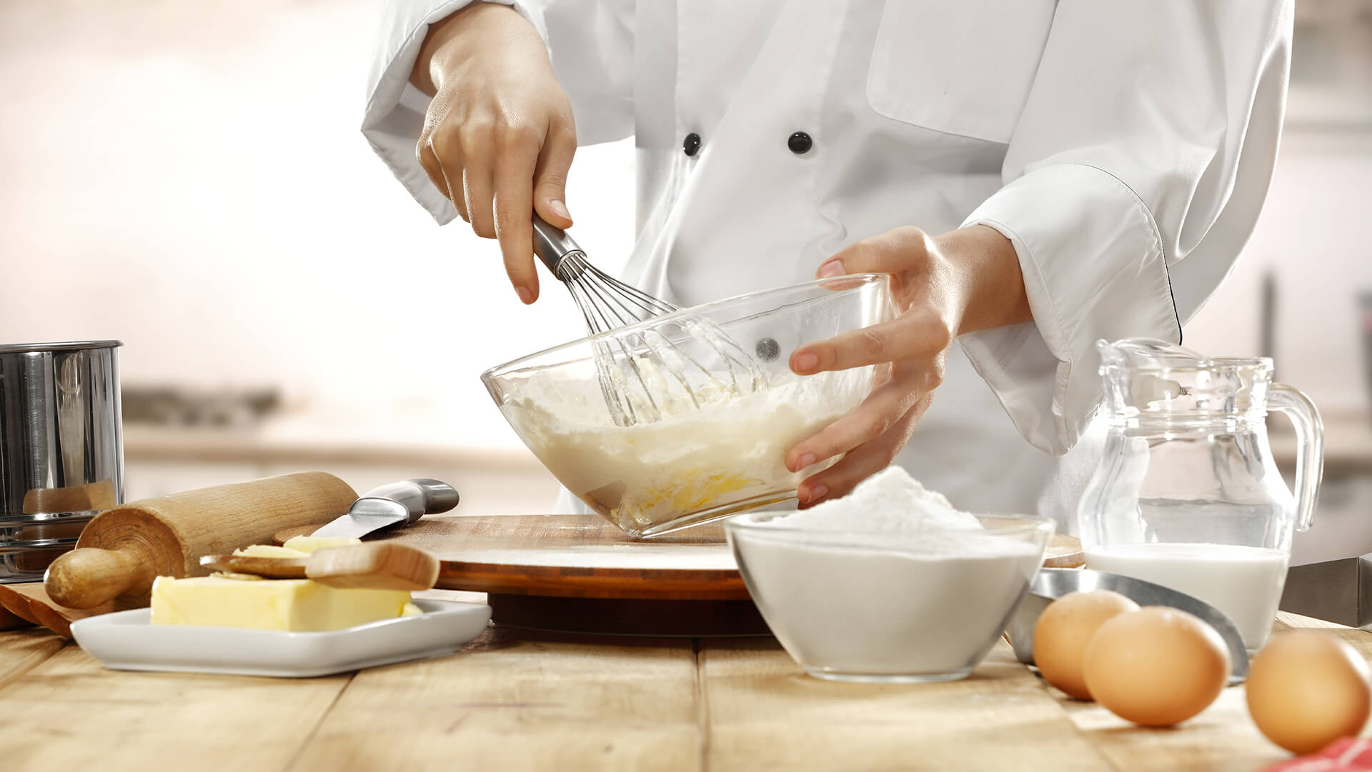 A chief biting egg with milk